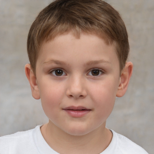 Joyful white child male with short  brown hair and brown eyes