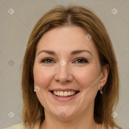 Joyful white adult female with medium  brown hair and brown eyes