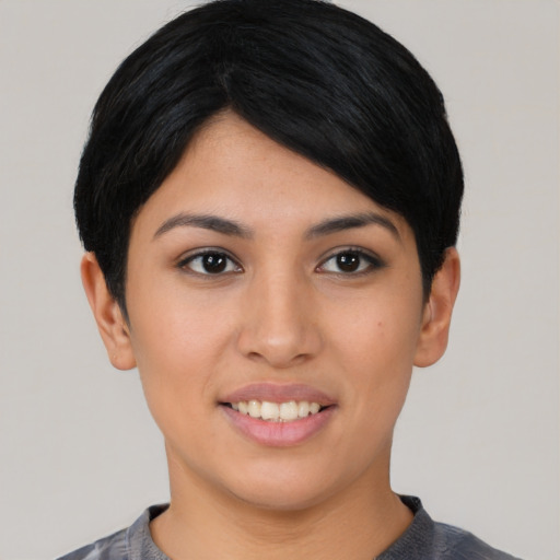 Joyful asian young-adult female with short  black hair and brown eyes