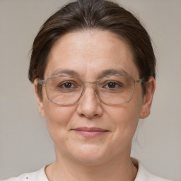 Joyful white adult female with short  brown hair and brown eyes