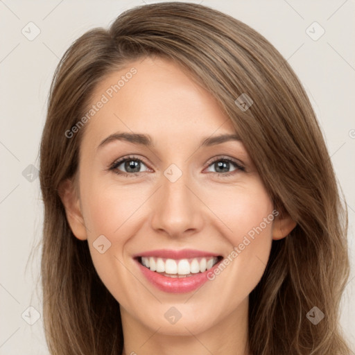 Joyful white young-adult female with long  brown hair and green eyes