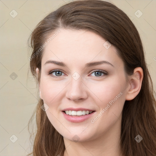 Joyful white young-adult female with long  brown hair and grey eyes