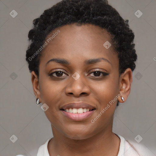 Joyful black young-adult female with short  black hair and brown eyes