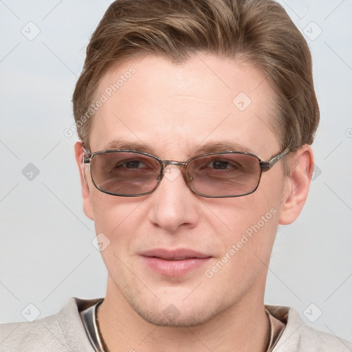 Joyful white young-adult male with short  brown hair and blue eyes