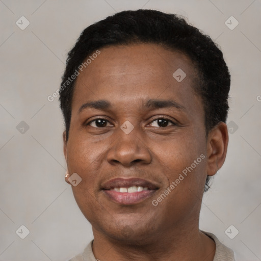 Joyful black adult male with short  brown hair and brown eyes