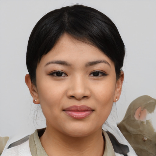 Joyful asian young-adult female with medium  black hair and brown eyes