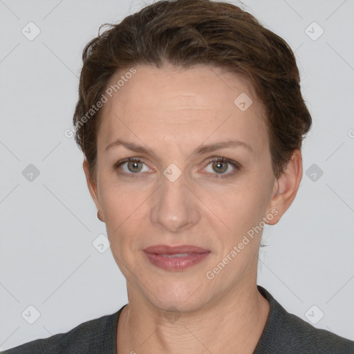 Joyful white adult female with short  brown hair and grey eyes