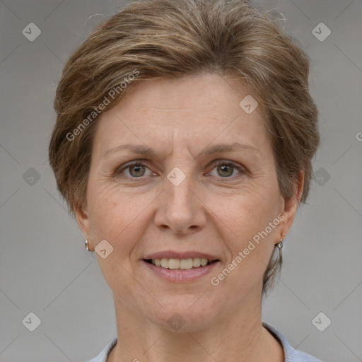 Joyful white adult female with short  brown hair and grey eyes