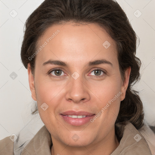 Joyful white adult female with medium  brown hair and grey eyes