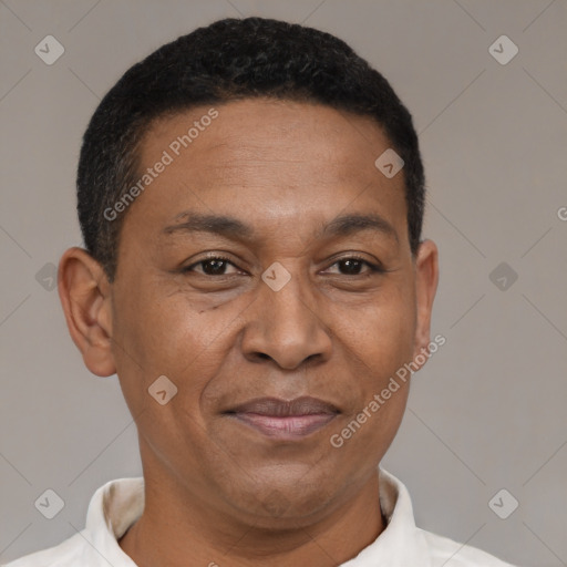 Joyful latino adult male with short  black hair and brown eyes