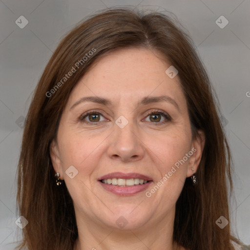 Joyful white adult female with long  brown hair and brown eyes