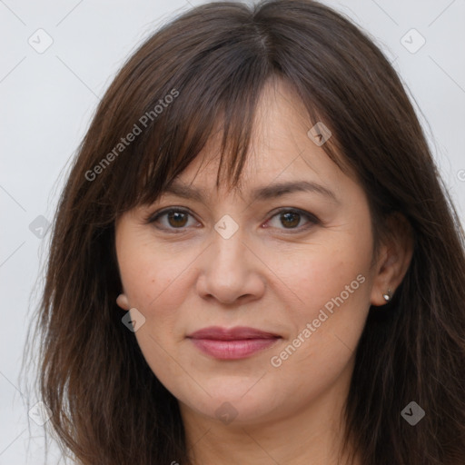 Joyful white adult female with long  brown hair and brown eyes