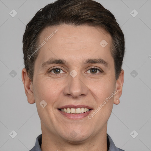 Joyful white adult male with short  brown hair and brown eyes