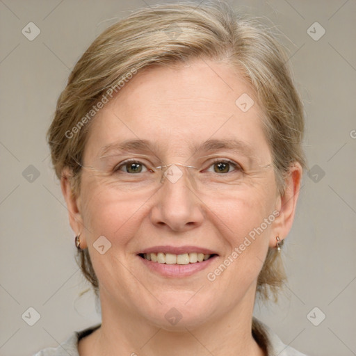 Joyful white adult female with medium  brown hair and green eyes