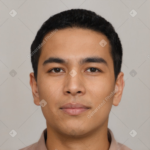 Neutral latino young-adult male with short  black hair and brown eyes