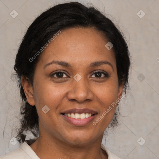 Joyful black adult female with medium  brown hair and brown eyes