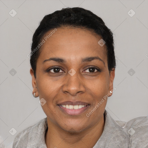 Joyful black adult female with short  black hair and brown eyes