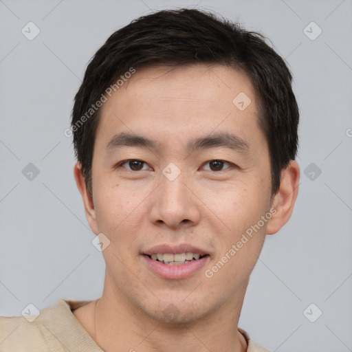 Joyful asian young-adult male with short  brown hair and brown eyes