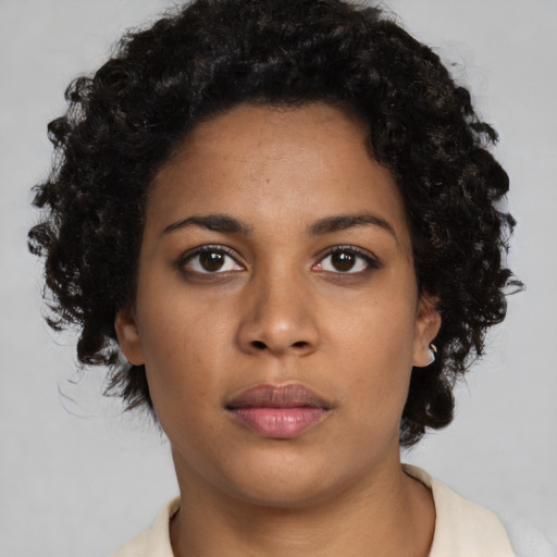 Neutral black young-adult female with short  black hair and brown eyes