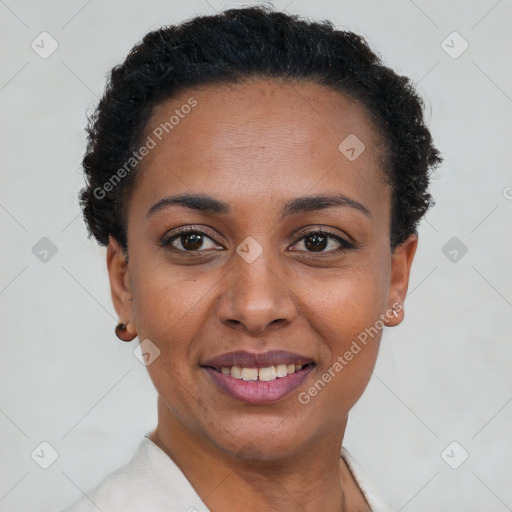 Joyful black young-adult female with short  brown hair and brown eyes