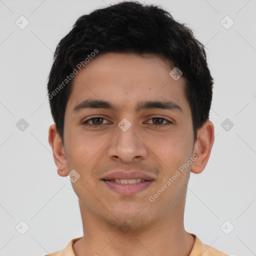 Joyful latino young-adult male with short  brown hair and brown eyes