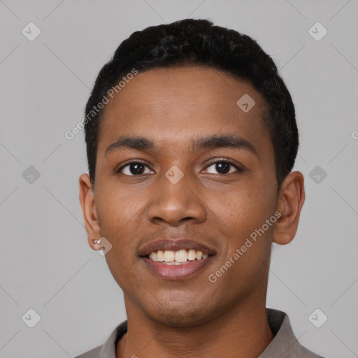 Joyful black young-adult male with short  black hair and brown eyes