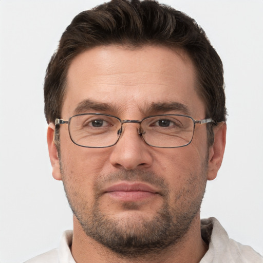 Joyful white adult male with short  brown hair and brown eyes