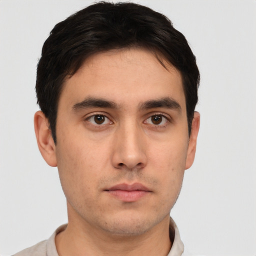 Neutral white young-adult male with short  black hair and brown eyes