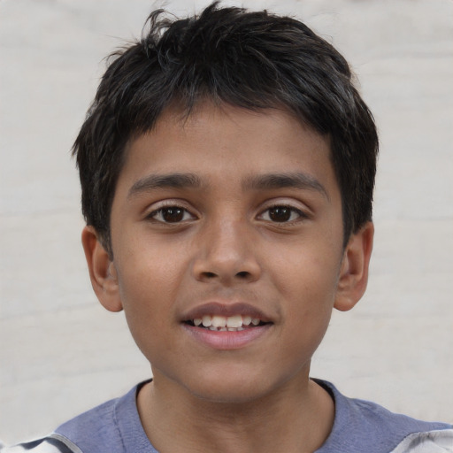 Joyful asian child male with short  brown hair and brown eyes