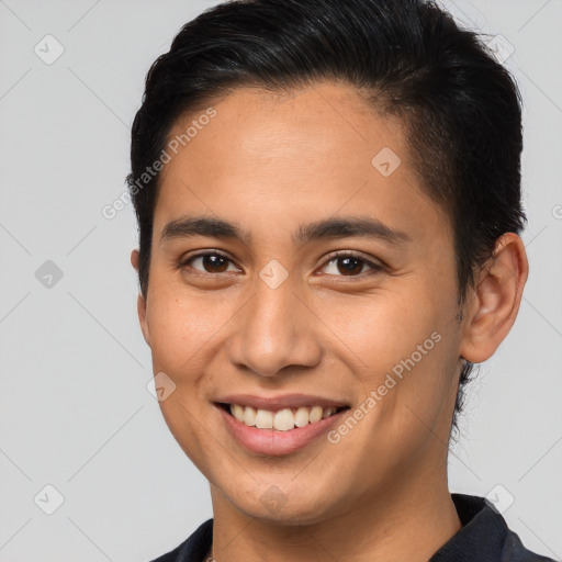 Joyful latino young-adult male with short  brown hair and brown eyes