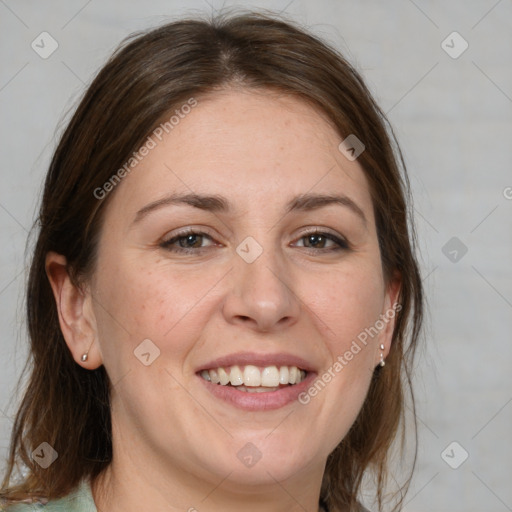 Joyful white adult female with medium  brown hair and grey eyes