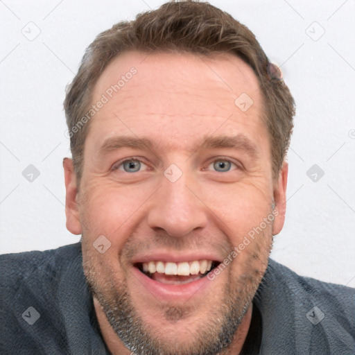 Joyful white adult male with short  brown hair and grey eyes