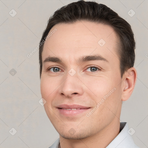 Joyful white young-adult male with short  brown hair and brown eyes