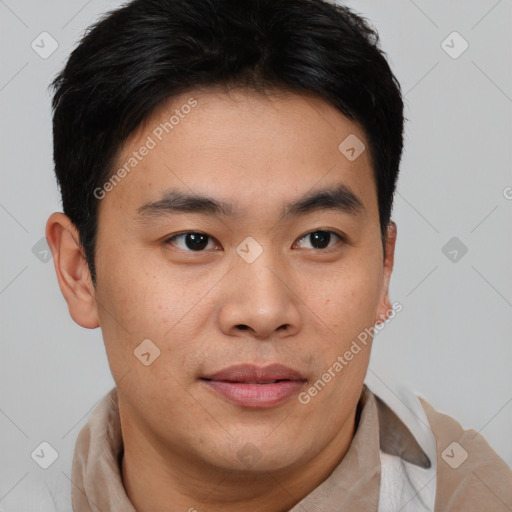 Joyful asian young-adult male with short  brown hair and brown eyes