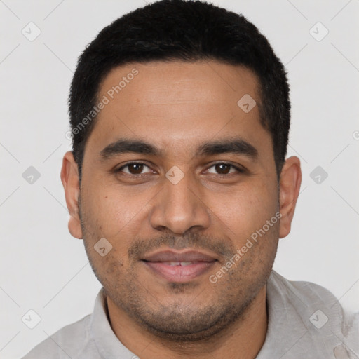 Joyful latino young-adult male with short  black hair and brown eyes