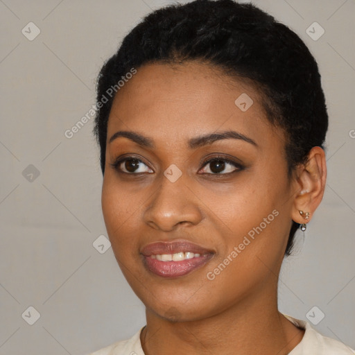 Joyful black young-adult female with short  black hair and brown eyes