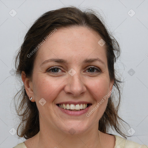 Joyful white adult female with medium  brown hair and grey eyes