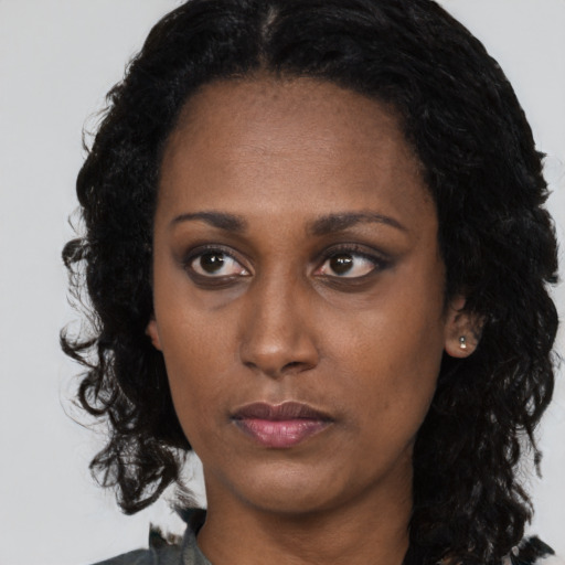 Neutral black young-adult female with long  black hair and brown eyes