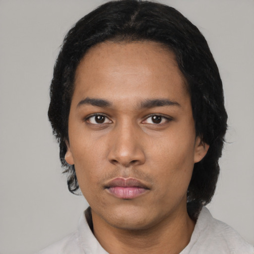 Neutral latino adult male with short  black hair and brown eyes