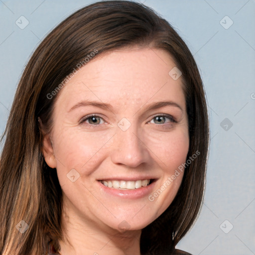 Joyful white young-adult female with long  brown hair and grey eyes