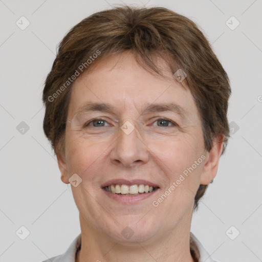 Joyful white adult female with short  brown hair and grey eyes