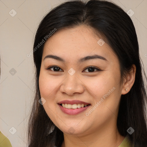 Joyful white young-adult female with long  brown hair and brown eyes