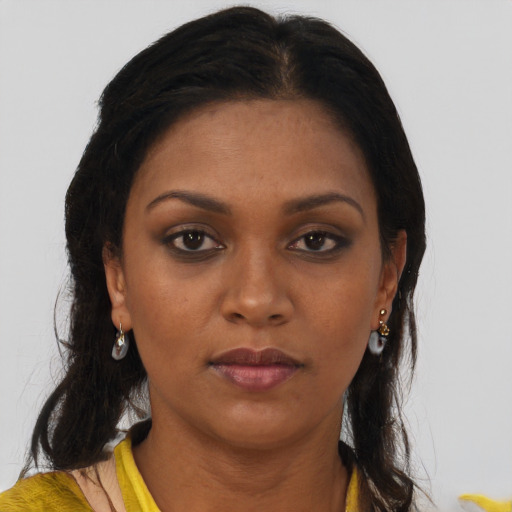 Neutral black young-adult female with long  brown hair and brown eyes