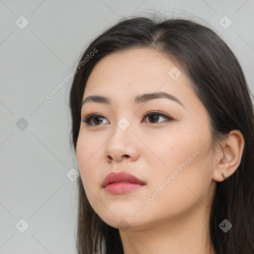 Neutral white young-adult female with long  brown hair and brown eyes