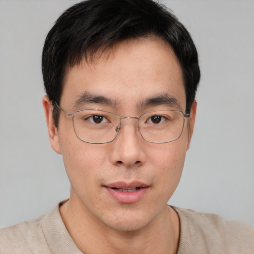 Neutral asian young-adult male with short  brown hair and brown eyes