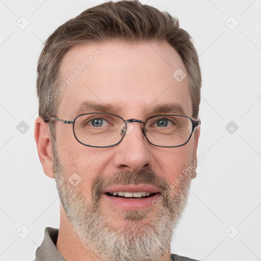 Joyful white adult male with short  brown hair and grey eyes