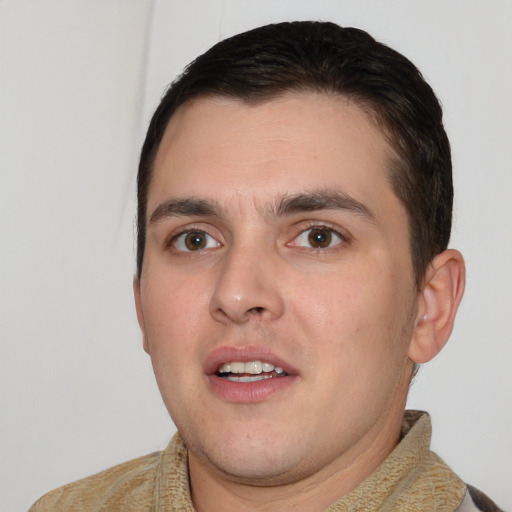 Joyful white young-adult male with short  brown hair and brown eyes