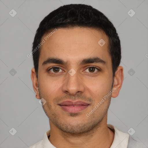 Joyful latino young-adult male with short  black hair and brown eyes