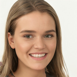 Joyful white young-adult female with long  brown hair and blue eyes