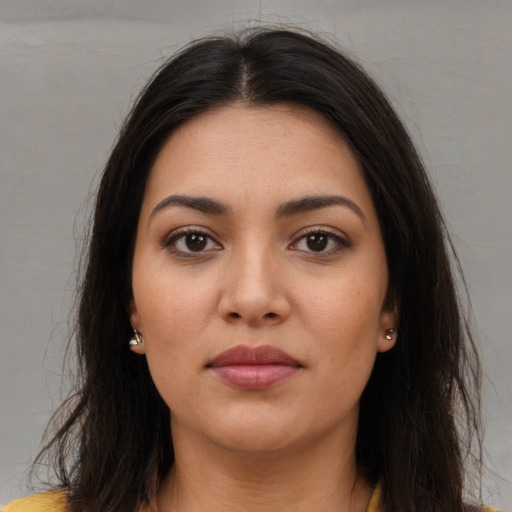 Neutral latino young-adult female with long  brown hair and brown eyes